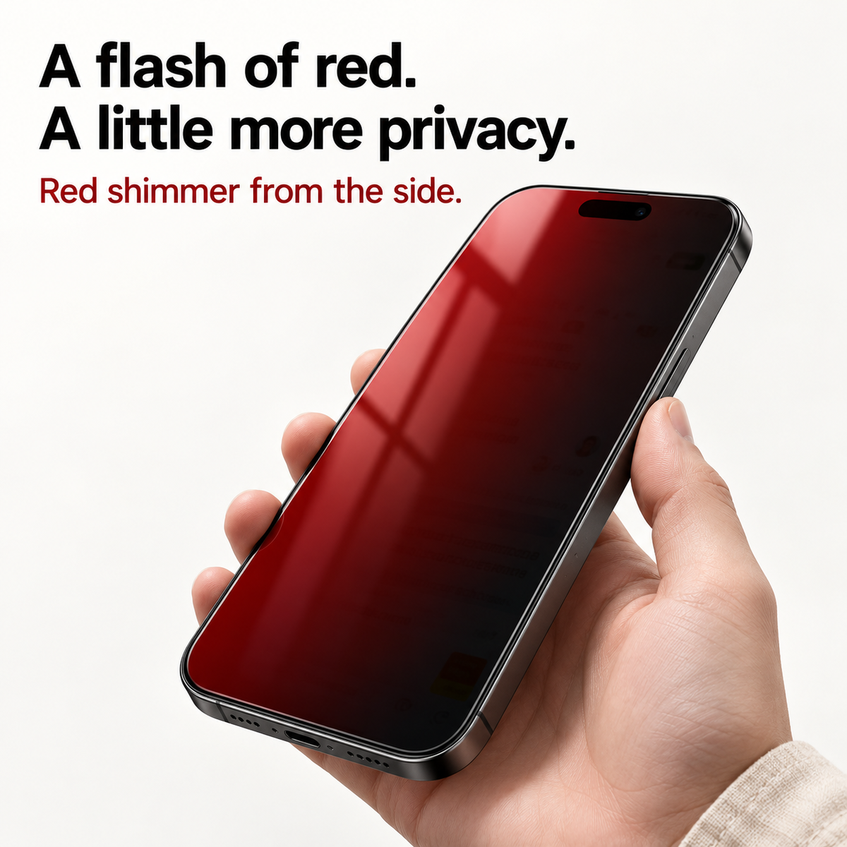 Close-up of red reflective shimmer on an angled phone screen fitted with privacy tempered glass.